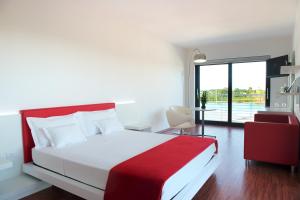A bed or beds in a room at Stay Michelangelo Jesolo Only Adults
