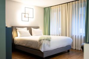 Cama o camas de una habitación en Hostellerie du Grünewald