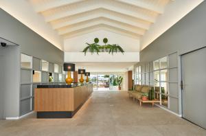 an office lobby with a coffered ceiling and a reception desk at Hoposa Montelin in Port de Pollensa