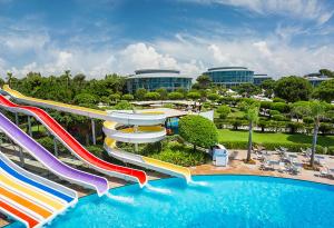 a pool with a water slide in a resort at Calista Luxury Resort in Belek