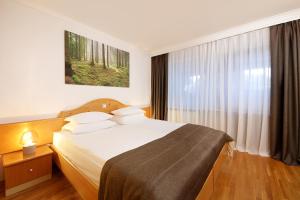 Katil atau katil-katil dalam bilik di Hotel Planja