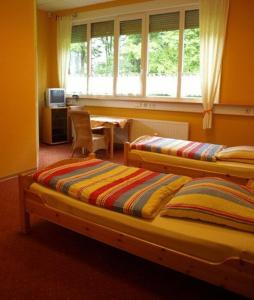 Voodi või voodid majutusasutuse Econo Motel Goelzer toas