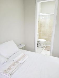 Ένα ή περισσότερα κρεβάτια σε δωμάτιο στο Sobrado 6 amplo e confortável em condomínio
