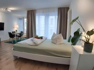 Ένα ή περισσότερα κρεβάτια σε δωμάτιο στο LEA Apartment Zentrum Nord