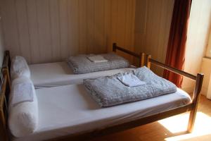 Llit o llits en una habitació de Gîte le Moulin