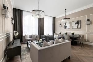 a living room with a couch and a table at Luxury Georgian City Retreat - Hot Tub - Patio in Edinburgh