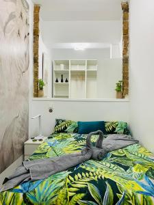 Ένα ή περισσότερα κρεβάτια σε δωμάτιο στο Precioso Apartamento Madrid Centro