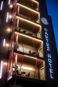 a building with a sign on the side of it at Cartez Hotel in Yerevan