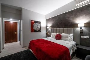 Postel nebo postele na pokoji v ubytování Lingos Hotel
