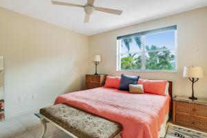 a bedroom with a bed and a window at Waterfront Wonder in Islamorada +47 photos