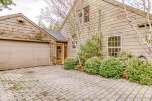 a house with a driveway and a garage at Hidden Zen in Portland