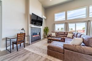 a living room with a couch and a fireplace at Pacific Breeze in Gold Beach