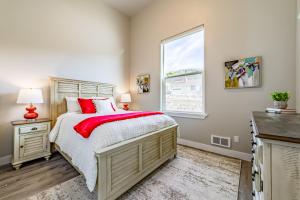 a bedroom with a large bed and a window at Pacific Breeze in Gold Beach