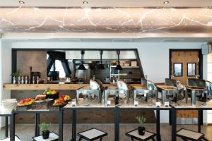 a restaurant with a table with food on it at Akti Toroni Boutique Hotel in Toroni