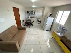 O zonă de relaxare la Apartamento super confortável e bem localizado.