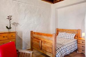 A bed or beds in a room at Mirador de Domingo