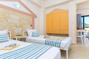 Postel nebo postele na pokoji v ubytování Ilios Malia Hotel Resort + 37 fotografií
