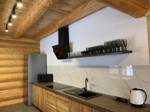a kitchen with a sink and a counter top at 4REST ZRUB in Tukhlya