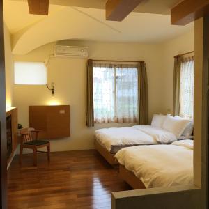 Postel nebo postele na pokoji v ubytování Qiao Kela Ti Homestay