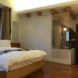 Postel nebo postele na pokoji v ubytování Qiao Kela Ti Homestay