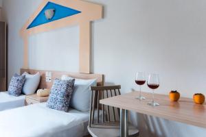 Ilios Malia Hotel Resort客房内的一张或多张床位