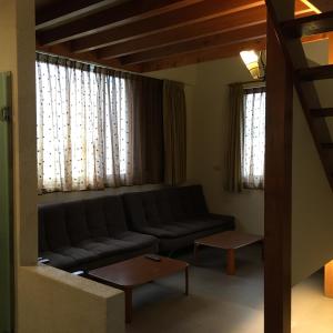 Posezení v ubytování Qiao Kela Ti Homestay