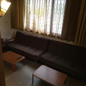 Posezení v ubytování Qiao Kela Ti Homestay