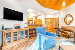 a living room with a flat screen tv on a wall at Deer Valley Courchevel Condo in Park City