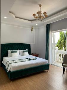 Letto o letti in una camera di Peach Valley Hotel Dalat