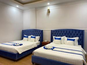 Letto o letti in una camera di Peach Valley Hotel Dalat
