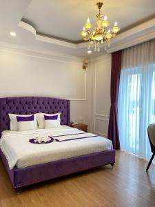 Letto o letti in una camera di Peach Valley Hotel Dalat