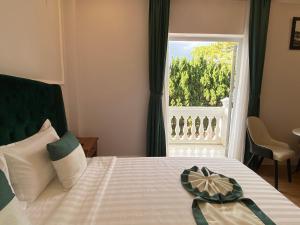 Letto o letti in una camera di Peach Valley Hotel Dalat