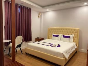 Letto o letti in una camera di Peach Valley Hotel Dalat