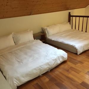 Postel nebo postele na pokoji v ubytování Qiao Kela Ti Homestay