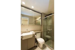 a bathroom with a toilet and a sink and a shower at Locking's Santo Agostinho 2 in Belo Horizonte