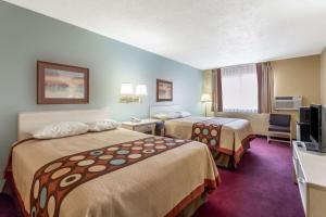 Tempat tidur dalam kamar di Super 8 by Wyndham Nephi