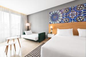 Ein Bett oder Betten in einem Zimmer der Unterkunft Mid Town Hotel Casablanca
