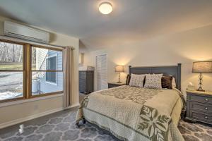 A bed or beds in a room at Berkshires Getaway with Deck and Mountain Views!