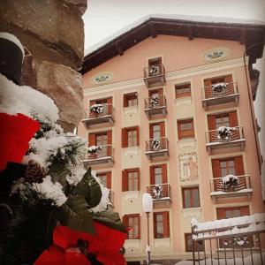 a building with snow on it in front of it at Villa Teresa in Limone Piemonte