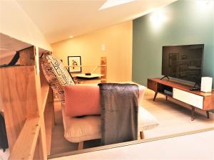 TV a/nebo společenská místnost v ubytování La Mezzanine par Picardie Homes