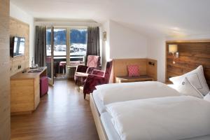 Postel nebo postele na pokoji v ubytování Hotel Menning ***S