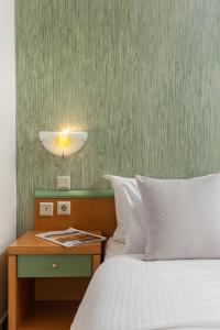 Postel nebo postele na pokoji v ubytování Dias Hotel Platamon