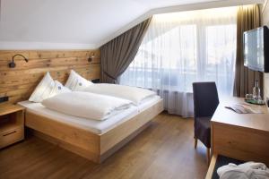 Postel nebo postele na pokoji v ubytování Hotel Menning ***S