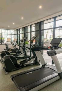 a row of cardio machines in a gym at Suasana Suites Homestay10 JB TOWN in Johor Bahru