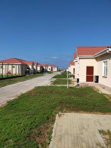 an empty street with houses in a village at SULO Bautino Hotel in Bautino