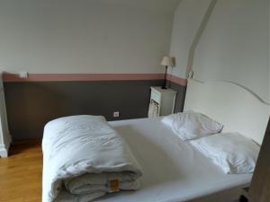 A bed or beds in a room at Gites Les Clairet