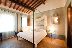 A bed or beds in a room at La Spinetta