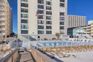 a building with an american flag in front of it at Gulf Tower 14W in Gulf Shores