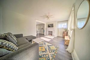a living room with a couch and a fireplace at Historic Family Home 2 Mi to Lake Erie and Zoo! in Erie