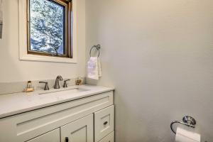 a bathroom with a sink and a window at Hot Tub and Mtn Views Silverthorne Escape! in Silverthorne +24 photos